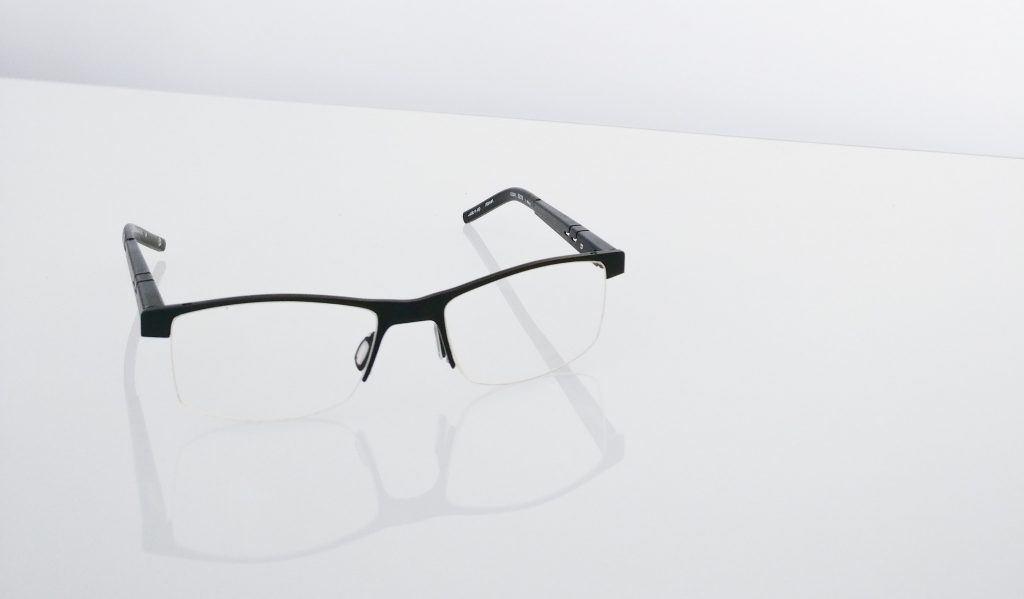 black half frame glasses on a white background